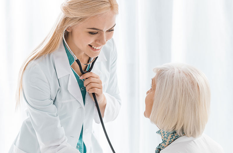 Physical therapist assisting a patient with exercises